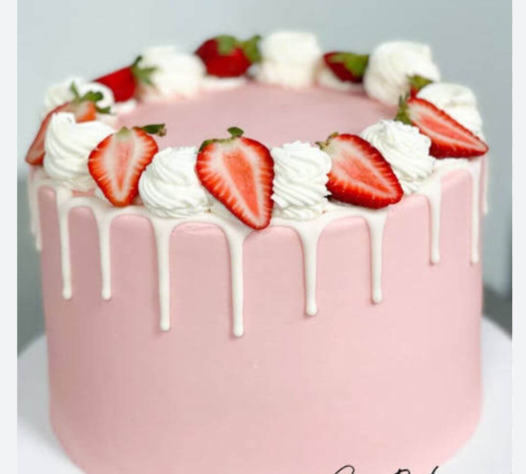 white dripping strawberry cake