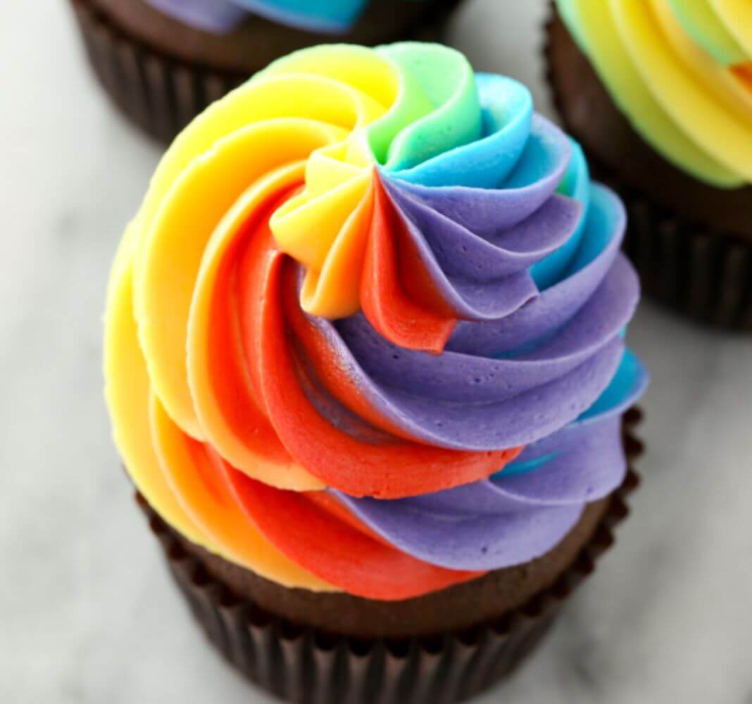 Eggless chocolate rainbow cupcakes.